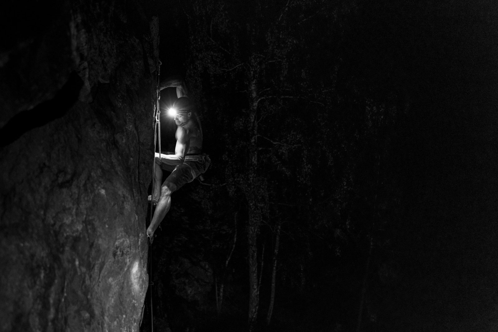 Climber with a headlamp at night