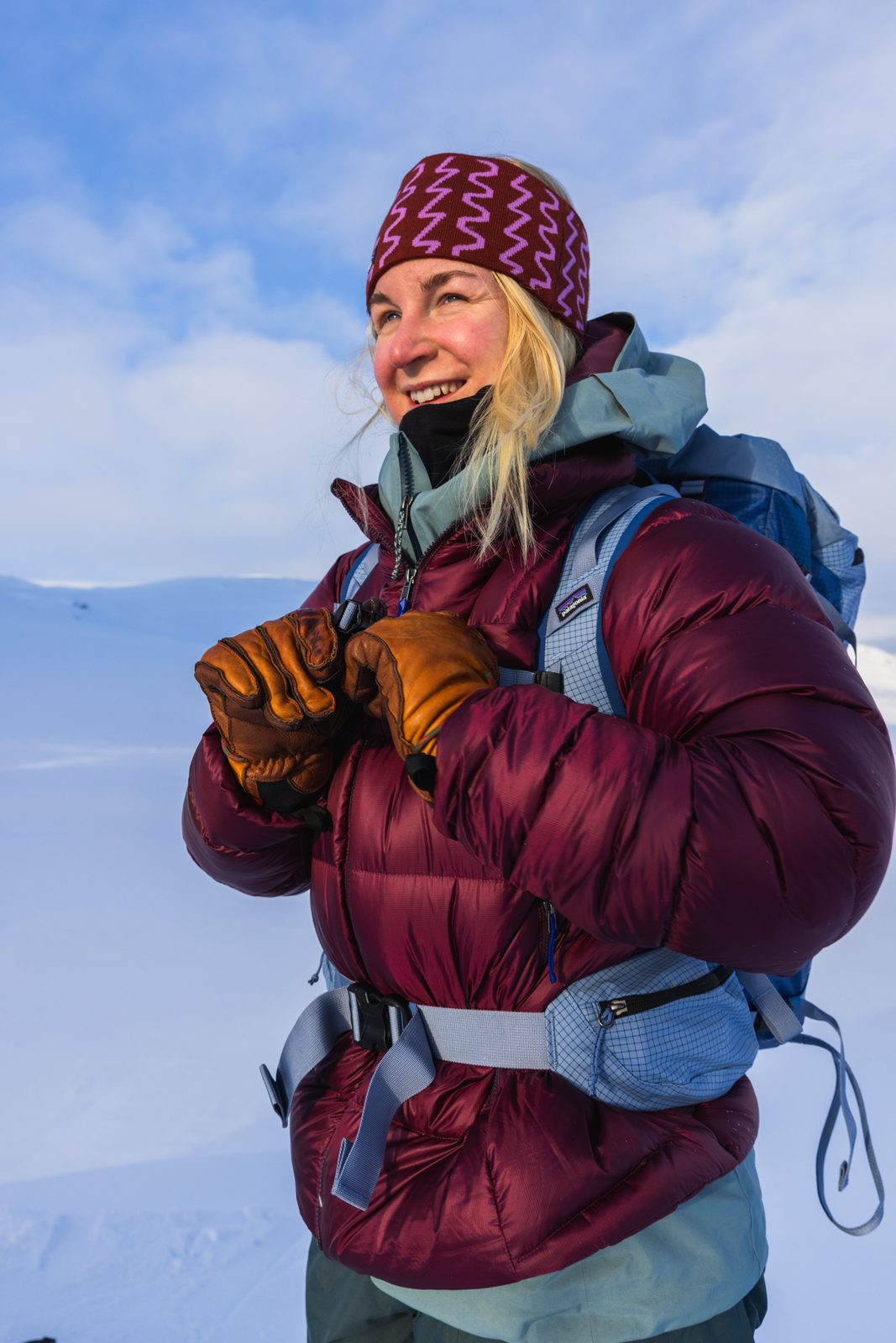 Smiling skier with a patterned headband