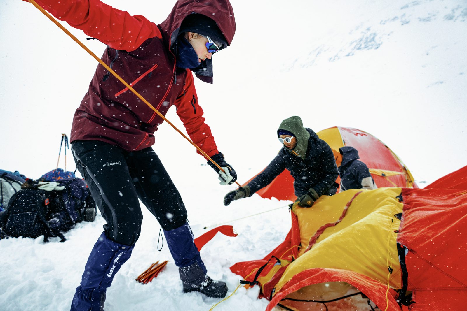 Pitching a tent in a snowstorm