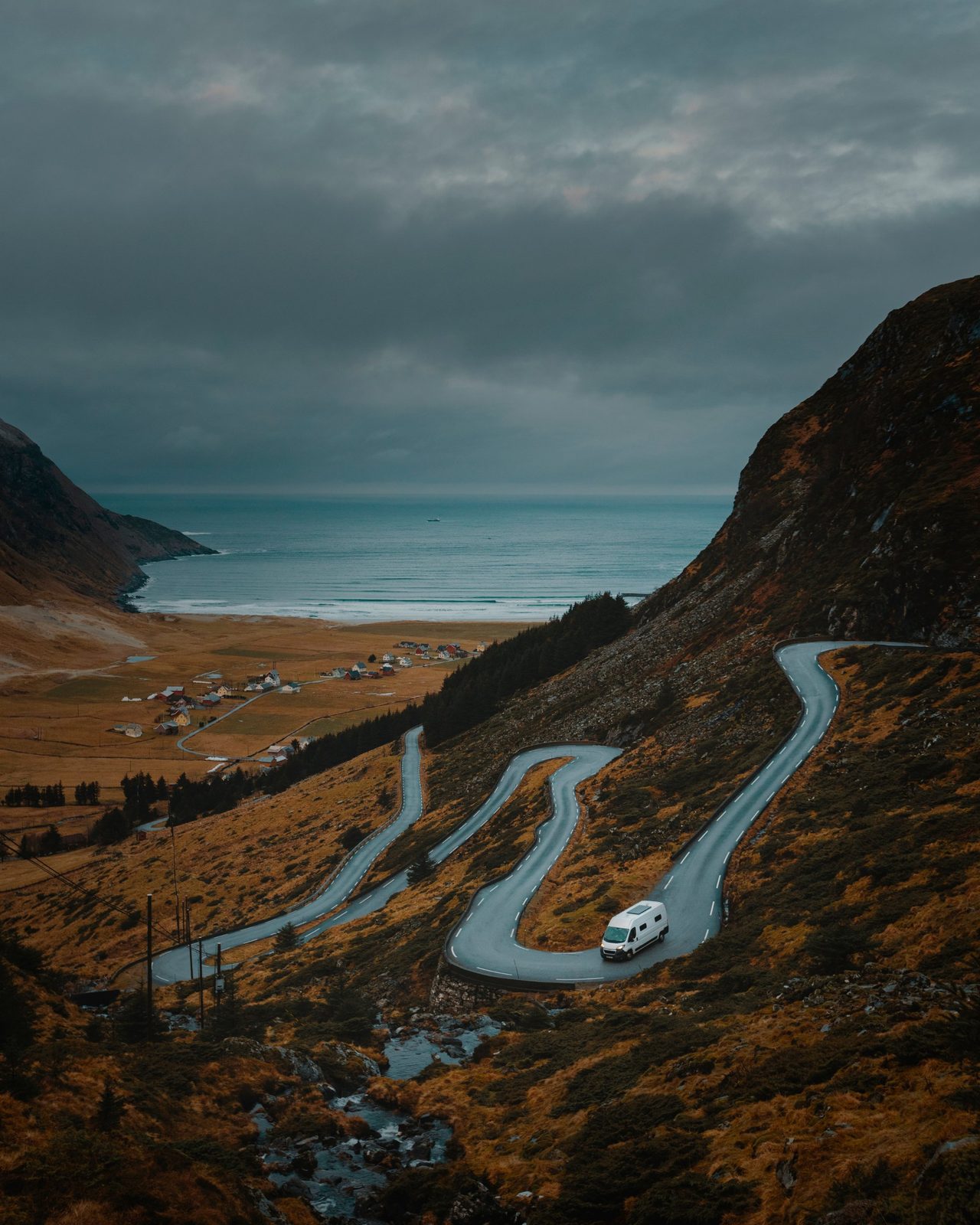 Camper van on a winding coastal road